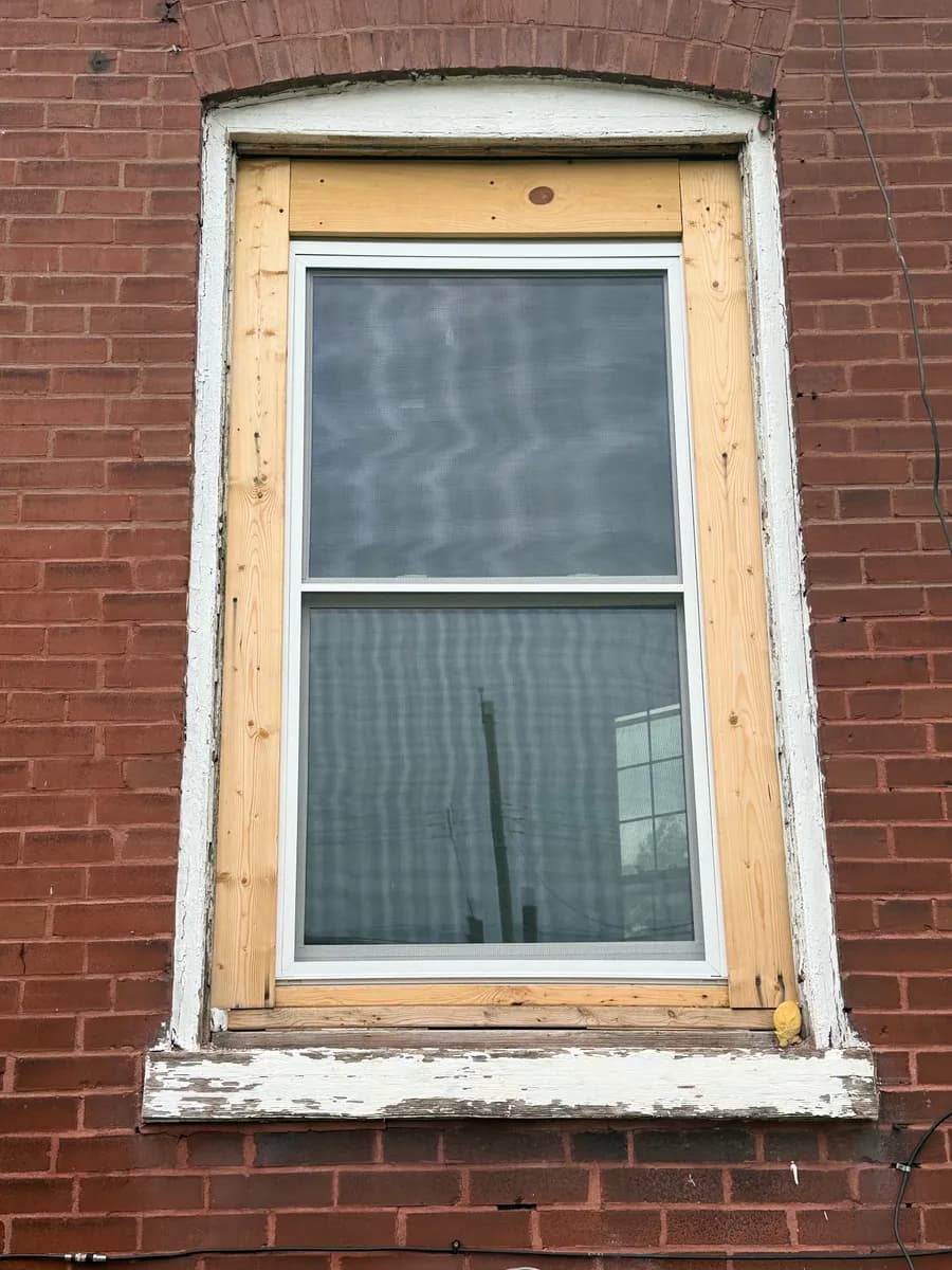 New double-hung window set square in a framed opening during installation